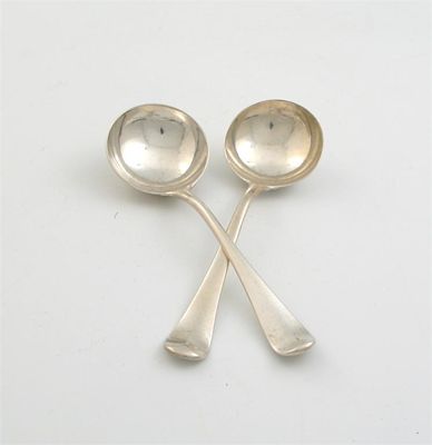 Appraisal: A pair of early George III Hanoverian sauce ladles initialled