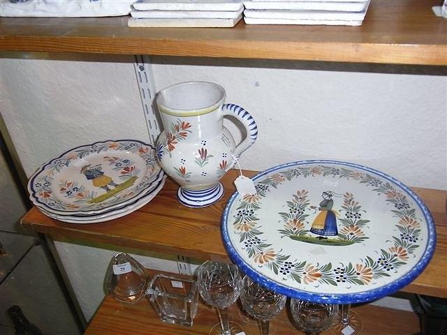 Appraisal: A COLLECTION OF QUIMPER WARE to include a jug decorated