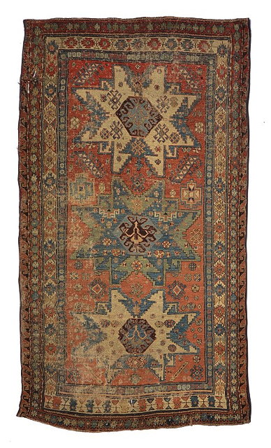 Appraisal: AN ANTIQUE CAUCASIAN LESGHI SOUMAC RED GROUND RUG with triple