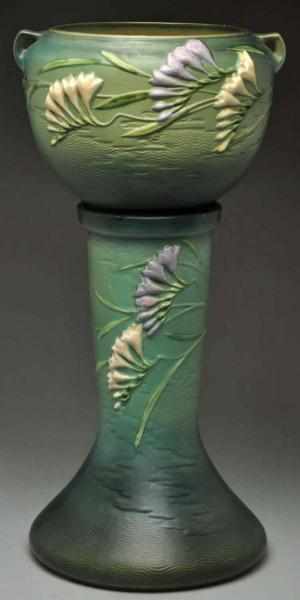 Appraisal: Roseville Green Freesia Jardiniere Pedestal Lavender and white freesia flowers