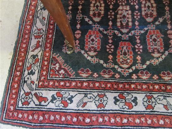 Appraisal: Green ground Persian carpet with multiple borders the centre with