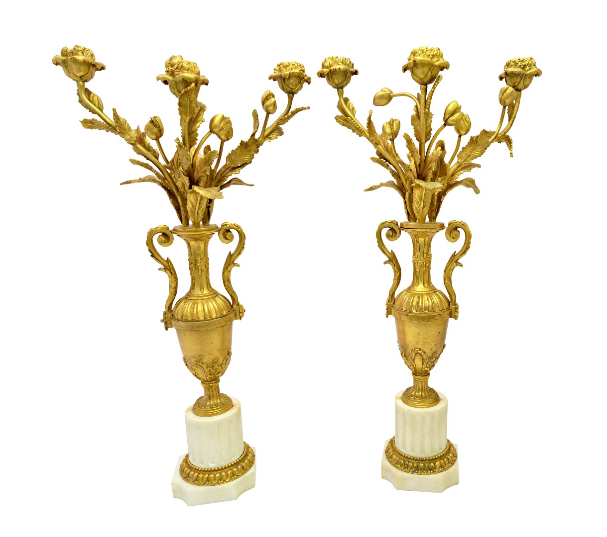 Appraisal: A pair of French ormolu and white marble three light