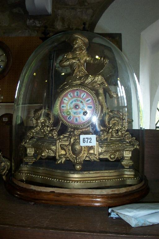 Appraisal: A mid th century gilded mantle clock with pink porcelain