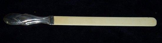 Appraisal: An ivory paper knife with silver handle Birmingham