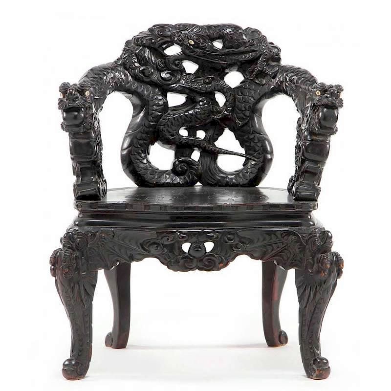 Appraisal: Chinese Heavily Carved Arm Chair early th century ironwood arms