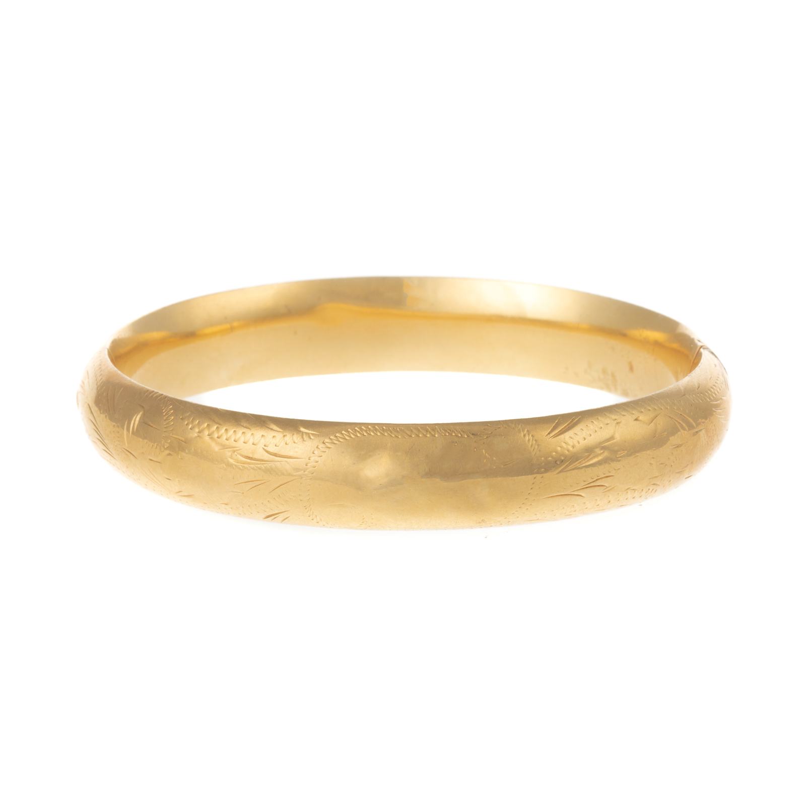 Appraisal: AN ENGRAVED BANGLE IN K YELLOW GOLD K yellow gold