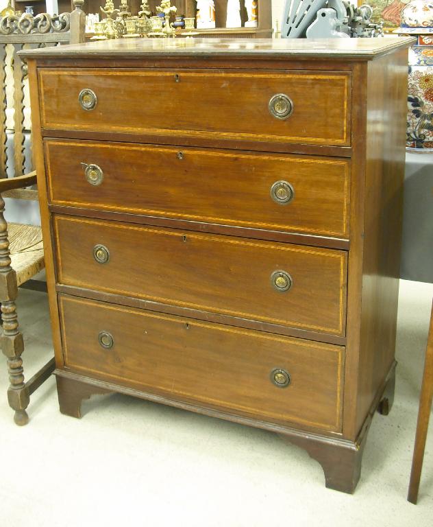 Appraisal: Edwardian mahogany and satinwood banded chest of four drawers supported