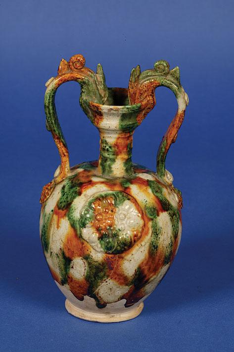 Appraisal: A CHINESE SANCAI VASE covered in a mottled green and