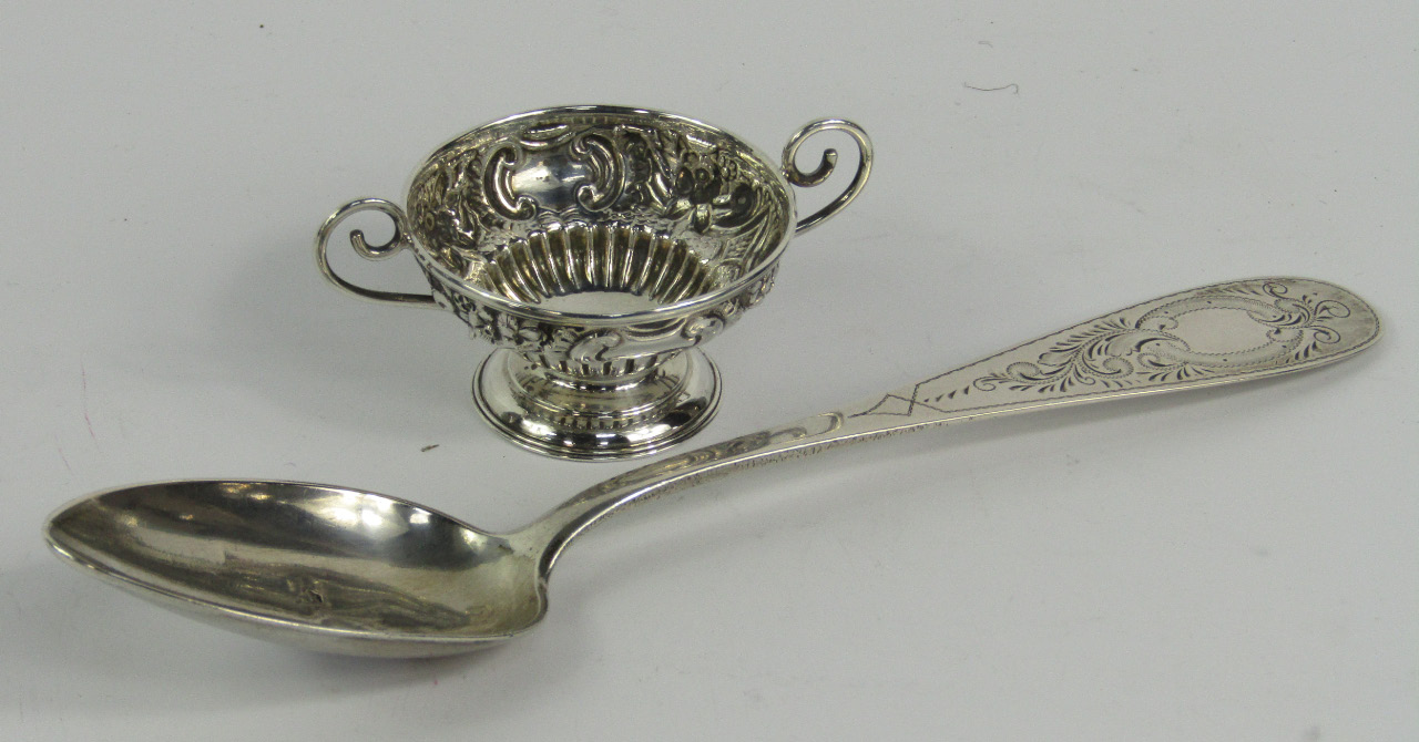 Appraisal: A Victorian silver twin handled cup of semi fluted ogee