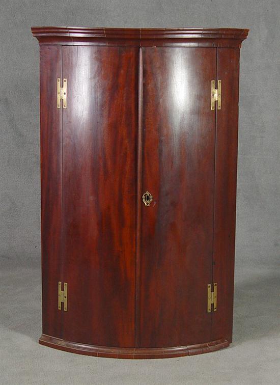 Appraisal: English Mahogany Hanging Corner Cupboard th Century Bow front with