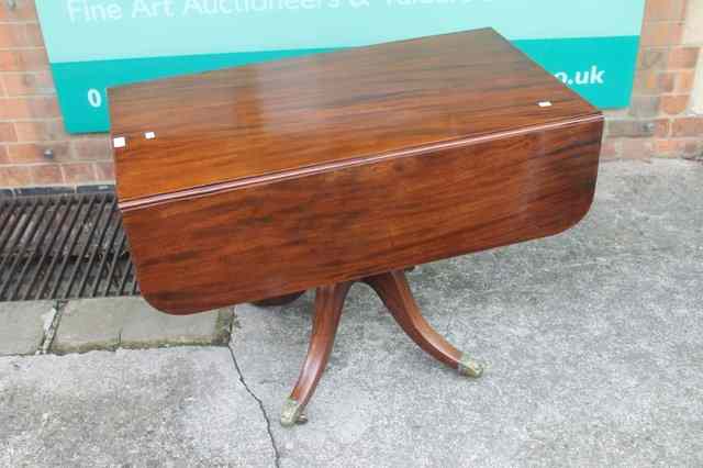 Appraisal: A REGENCY MAHOGANY SOFA TABLE fitted with fall flaps one