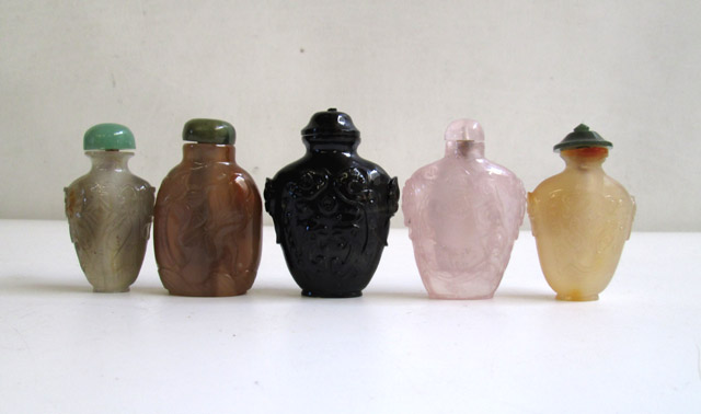 Appraisal: FIVE CHINESE SNUFF BOTTLES in agate rose quarts and glass