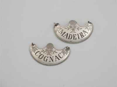 Appraisal: A pair of early th century engraved crescent wine labels