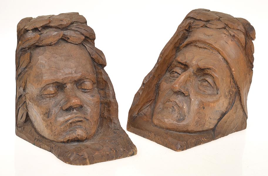 Appraisal: A PAIR OF WOOD CARVED FIGURAL BOOKENDS