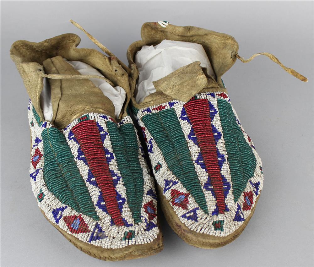 Appraisal: NATIVE AMERICAN BEADED HIDE MOCCASINS Plains circa hard soles sinew-sewn