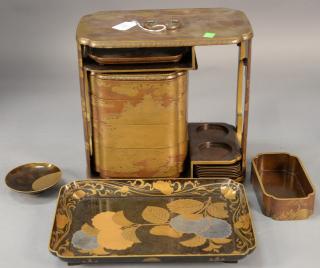 Appraisal: Two Japanese gold lacquered pieces to include a portable luncheon