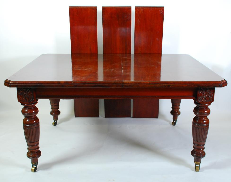 Appraisal: LARGE VICTORIAN WALNUT WIND OUT DINING TABLE the oblong moulded