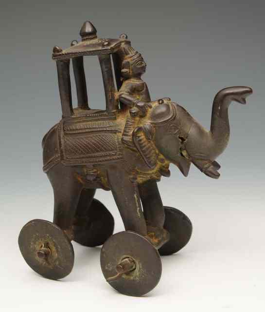 Appraisal: AN INDIAN BRONZE MODEL of an elephant with howdah high