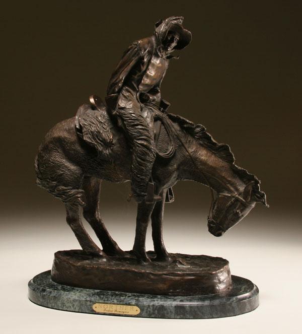 Appraisal: After Frederic Remington bronze Norther bundled cowboy in wooly chaps