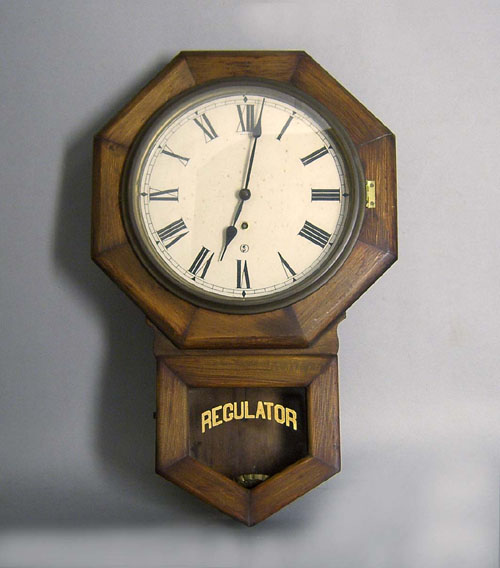 Appraisal: Oak wall clock together with a regulator clock h h