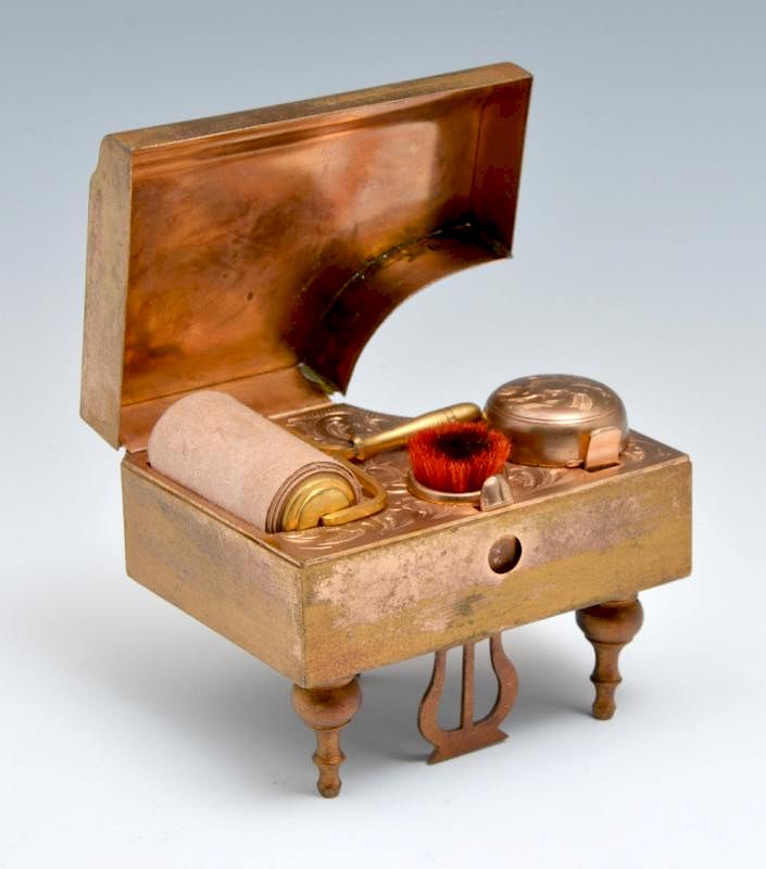 Appraisal: Piano shaped box with set of writing implements Piano shaped