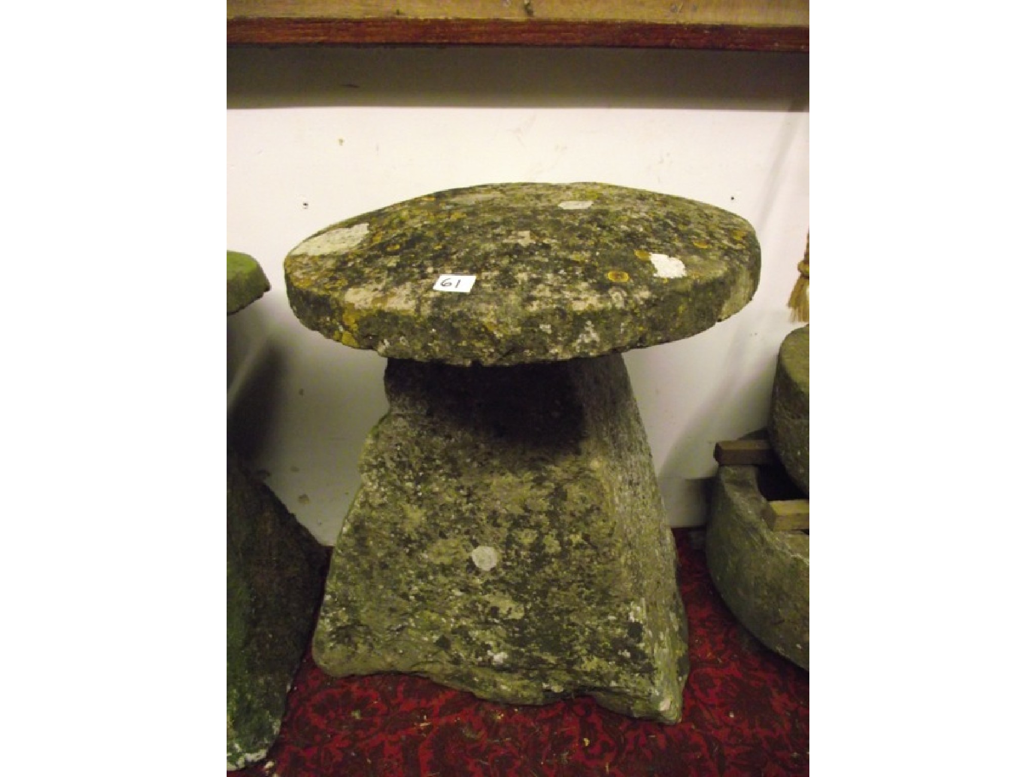 Appraisal: A weathered natural stone staddle stone of tapered form with