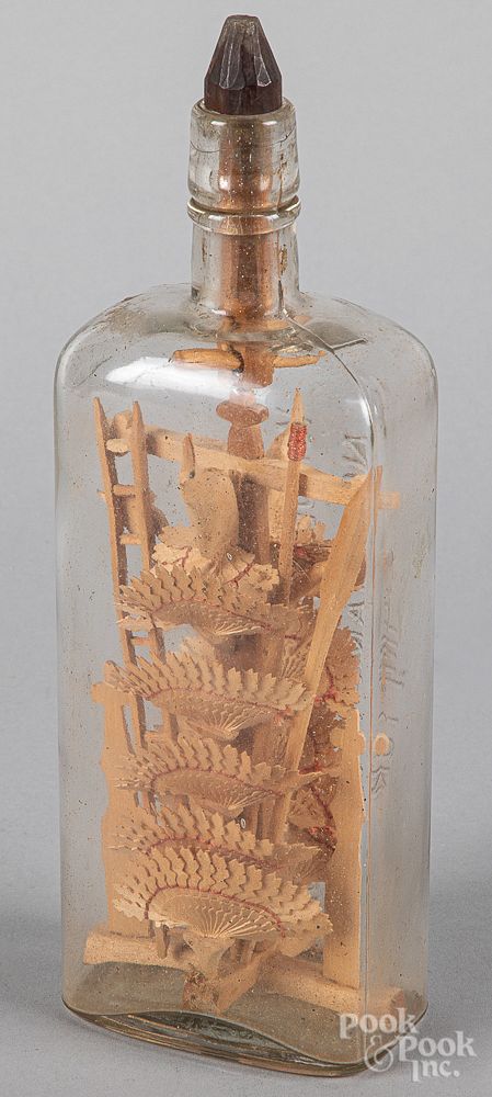 Appraisal: Carved whimsey in a bottle Carved whimsey in a bottle