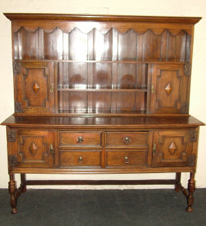 Appraisal: An oak dresser th century the moulded cornice above arched