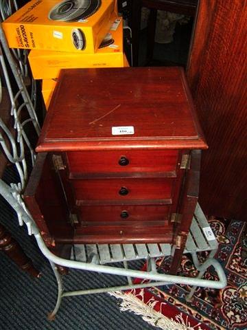 Appraisal: A Victorian mahogany table top chest of three drawers enclosed