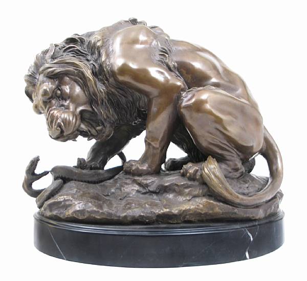 Appraisal: A patinated bronze figure of a crouching lion height in