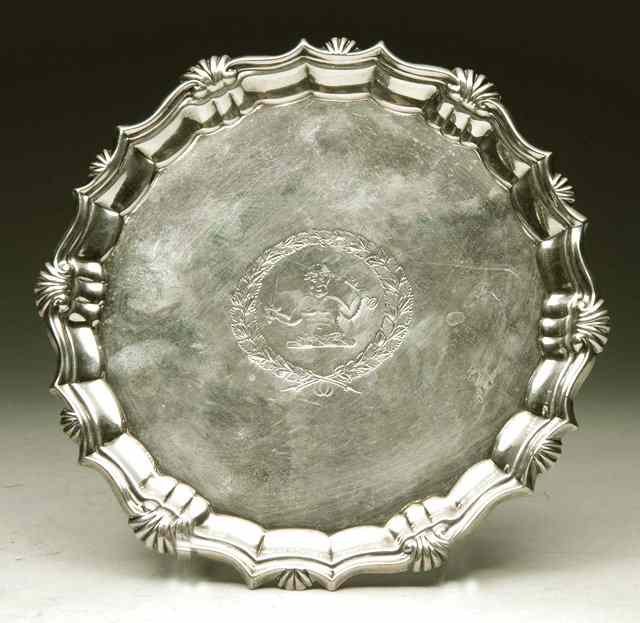 Appraisal: A GEORGE II SILVER WAITER with shell and scroll border