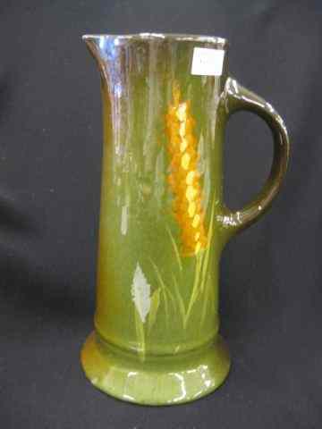 Appraisal: Art Pottery Tankard Louwelsa type handpainted foxglove floral standard glaze