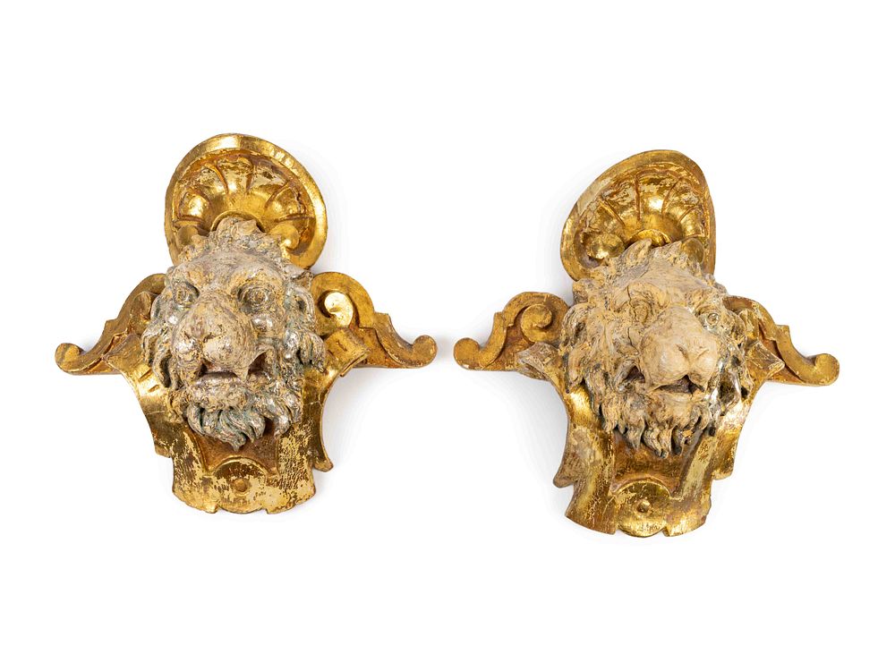 Appraisal: A Pair of English Part Silvered Giltwood Lion MasksHeight x