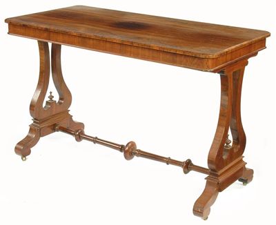 Appraisal: A Victorian rosewood writing table the rectangular top with a