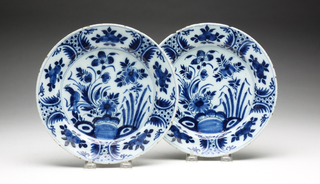 Appraisal: PAIR OF DELFT PLATES Eighteenth century Matching blue and white