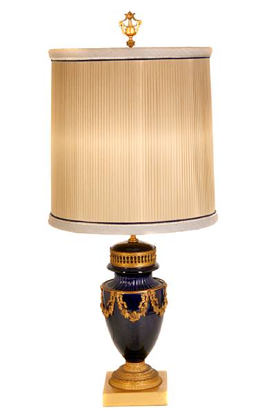 Appraisal: A pair of gilt metal mounted cobalt blue porcelain lamps