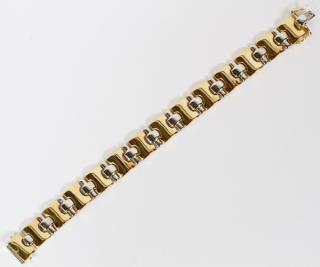 Appraisal: KT YELLOW AND WHITE GOLD LINK BRACELET KT YELLOW AND