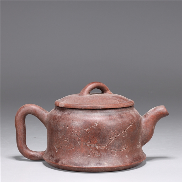 Appraisal: Chinese Yixing pottery teapot the body with incised floral designs