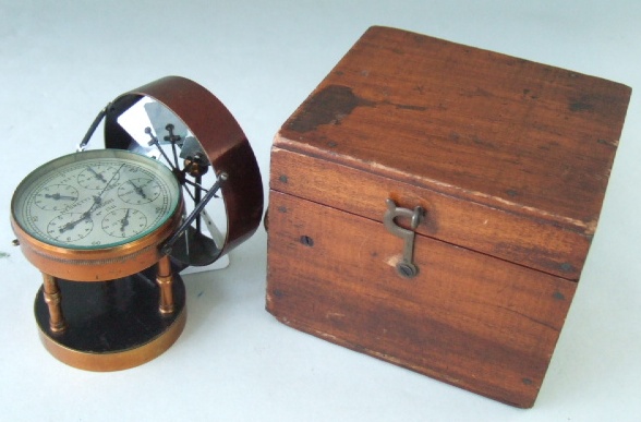 Appraisal: A Negretti and Zambra wind powered altimeter in a mahogany