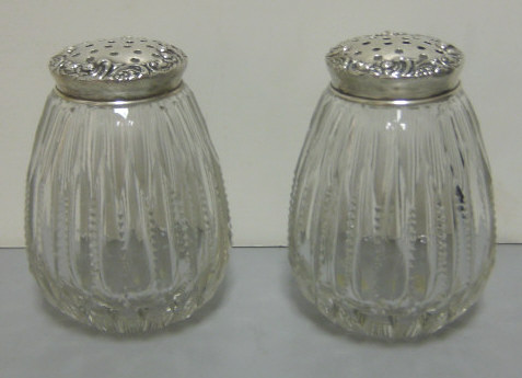 Appraisal: PAIR OF MUFFINEERS CIRCA Cut glass with sterling silver pierced