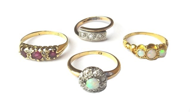 Appraisal: A gold opal and diamond set nine stone cluster ring