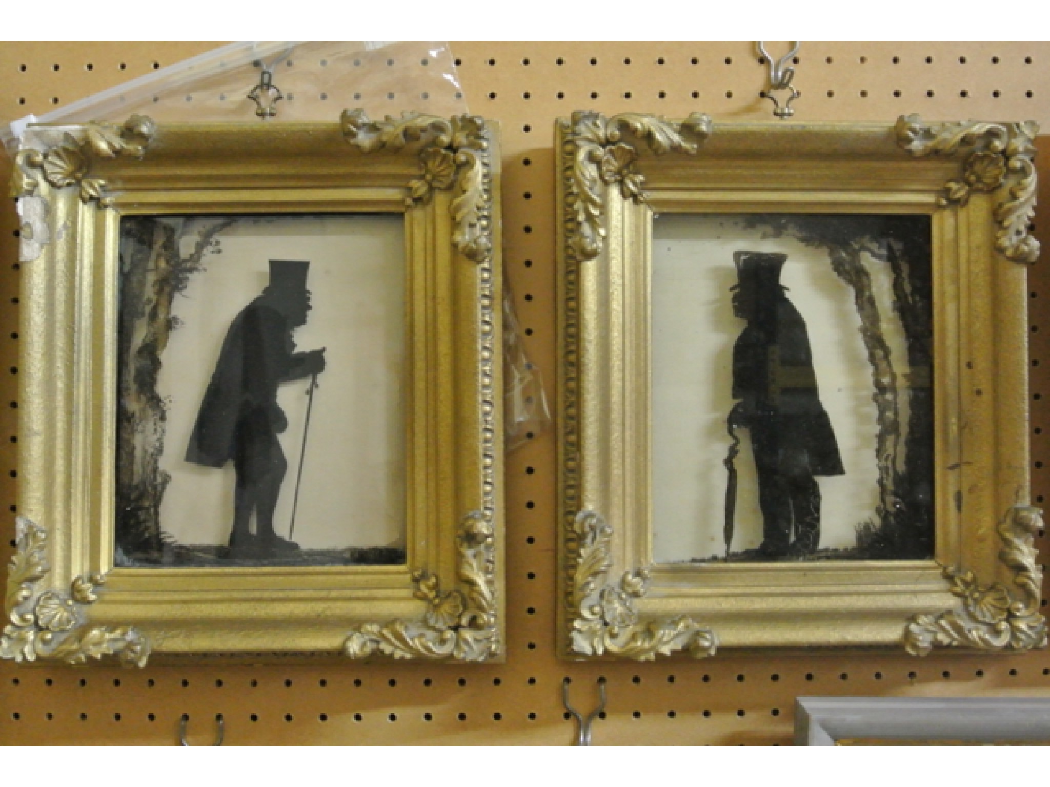 Appraisal: A pair of th century silhouette paintings on glass panels