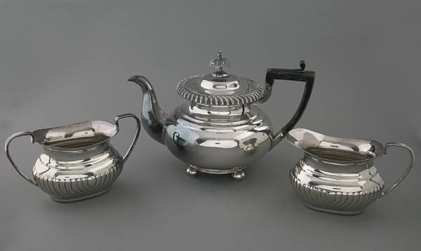 Appraisal: A Sheffield style assembled plated three piece teaset and a