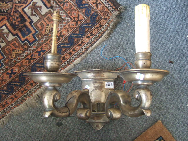 Appraisal: A pair of patented brass two branch wall lights of