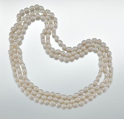 Appraisal: An Opera Strand of Oval Freshwater Pearls A hand-knotted strand