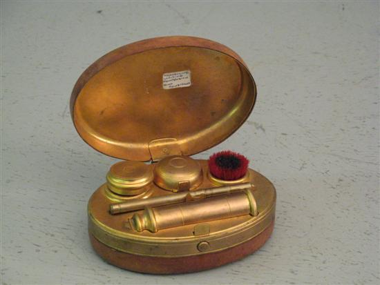 Appraisal: Leather covered and brass oval travelling writing compendium with two