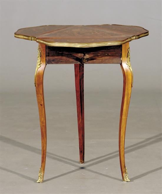 Appraisal: French style mahogany and marquetry occasional table early th century