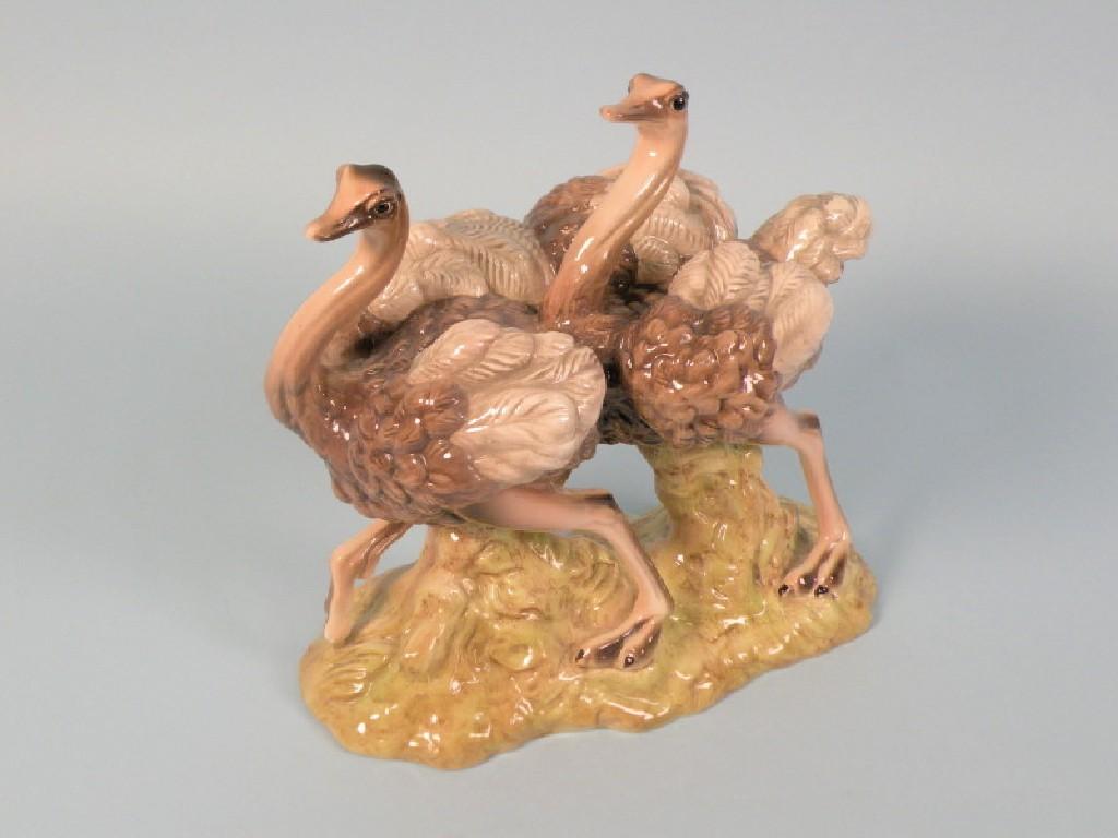 Appraisal: A Goldscheider pottery group of two ostriches each on a