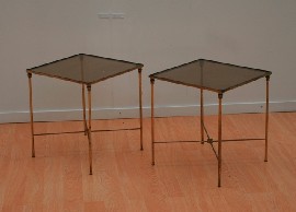 Appraisal: A pair of brass and glass occasional tables the square