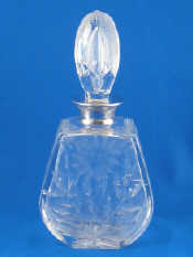 Appraisal: A silver mounted cut glass decanter the slab sided mallet